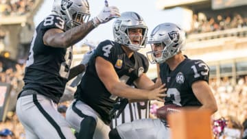 November 3, 2019; Oakland, CA, USA; Oakland Raiders wide receiver Hunter Renfrow (13) is congratulated by tight end Darren Waller (83) and quarterback Derek Carr (4) for catching a touchdown during the fourth quarter against the Detroit Lions at Oakland Coliseum. Mandatory Credit: Kyle Terada-USA TODAY Sports