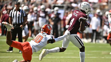 Sep 24, 2022; Starkville, Mississippi, USA; Mississippi State Bulldogs wide receiver Caleb Ducking (4) runs the ball while defended by Bowling Green Falcons cornerback Jordan Oladokun (10) during the second quarter at Davis Wade Stadium at Scott Field. Mandatory Credit: Matt Bush-USA TODAY Sports
