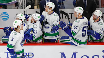 Oct 21, 2021; Chicago, Illinois, USA; Vancouver Canucks right wing Brock Boeser (6) celebrates with teammates after scoring against the Chicago Blackhawks during the second period at United Center. Mandatory Credit: Kamil Krzaczynski-USA TODAY Sports