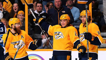 NASHVILLE, TN - MARCH 13: Kevin Fiala #22 of the Nashville Predators celebrates with teammates Ryan Ellis #4 and Craig Smith #15 after scoring a goal against the Winnipeg Jets during the first period at Bridgestone Arena on March 13, 2018 in Nashville, Tennessee. (Photo by Frederick Breedon/Getty Images)