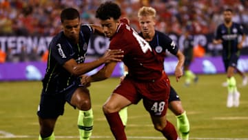 EAST RUTHERFORD, NJ - JULY 25: Cameron Humphreys #77 of Manchester City fights for the ball with Curtis Jones #48 of Liverpool during their match at MetLife Stadium on July 25, 2018 in East Rutherford, New Jersey. (Photo by Jeff Zelevansky/Getty Images)