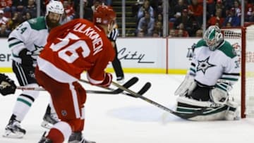 Nov 8, 2015; Detroit, MI, USA; Dallas Stars goalie Kari Lehtonen (32) makes the save on Detroit Red Wings left wing Teemu Pulkkinen (56) in the third period at Joe Louis Arena. Dallas won 4-1. Mandatory Credit: Rick Osentoski-USA TODAY Sports