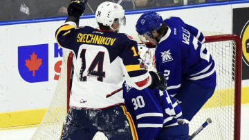 MISSISSAUGA, ON - JANUARY 19: Andrei Svechnikov #14 of the Barrie Colts celebrates his goal against Tyler Tucker #2 and Emanuel Vella #30 of the Mississauga Steelheads during game action on January 19, 2018 at Hershey Centre in Mississauga, Ontario, Canada. (Photo by Graig Abel/Getty Images)