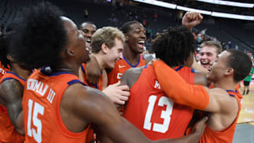 LAS VEGAS, NEVADA - NOVEMBER 24: Members of the Clemson Tigers celebrate their 62-60 overtime victory over the TCU Horned Frogs during the MGM Resorts Main Event basketball tournament at T-Mobile Arena on November 24, 2019 in Las Vegas, Nevada. (Photo by Ethan Miller/Getty Images)