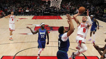 Feb 11, 2022; Chicago, Illinois, USA; Chicago Bulls guard Zach LaVine (8) shoots over Minnesota Timberwolves center Karl-Anthony Towns (32) during the second half at United Center. Mandatory Credit: Dennis Wierzbicki-USA TODAY Sports