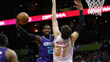 Feb 28, 2016; Atlanta, GA, USA; Charlotte Hornets forward Marvin Williams (2) shoots past Atlanta Hawks forward Mike Muscala (31) in the first quarter at Philips Arena. Mandatory Credit: Brett Davis-USA TODAY Sports