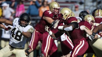 Oct 10, 2015; Boston, MA, USA; Boston College Eagles running back Marcus Outlow (7) runs with the ball with Wake Forest Demon Deacons linebacker Brandon Chubb (48) in pursuit during the first half at Alumni Stadium. Mandatory Credit: Gregory J. Fisher-USA TODAY Sports