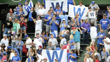 Sep 23, 2016; Chicago, IL, USA; Fans in the bleachers celebrate the Chicago Cubs win against the St. Louis Cardinals at Wrigley Field. The Cubs won 5-0. Mandatory Credit: David Banks-USA TODAY Sports