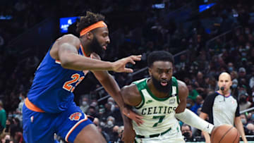Jan 8, 2022; Boston, Massachusetts, USA; Boston Celtics guard Jaylen Brown (7) drives to the basket against New York Knicks center Mitchell Robinson (23) during the second half at TD Garden. Mandatory Credit: Bob DeChiara-USA TODAY Sports