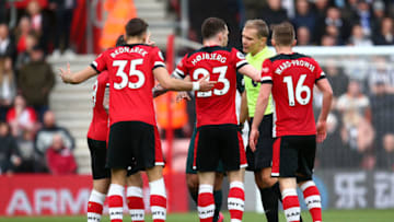 SOUTHAMPTON, ENGLAND - MARCH 07: Southampton FC players surround Referee Graham Scott a decision goes against them during the Premier League match between Southampton FC and Newcastle United at St Mary's Stadium on March 07, 2020 in Southampton, United Kingdom. (Photo by Charlie Crowhurst/Getty Images)
