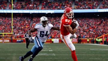 KANSAS CITY, MO - JANUARY 06: Tight end Travis Kelce #87 of the Kansas City Chiefs catches a pass in the endzone for a touchdown as inside linebacker Avery Williamson #54 of the Tennessee Titans defends during the 1st quarter of the AFC Wild Card Playoff game at Arrowhead Stadium on January 6, 2018 in Kansas City, Missouri. (Photo by Jamie Squire/Getty Images)