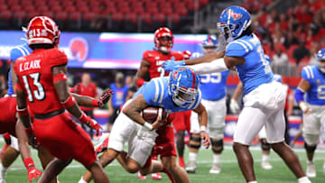 ATLANTA, GEORGIA - SEPTEMBER 06: Matt Corral #2 of the Mississippi Rebels rushes for a touchdown against Jack Fagot #38 of the Louisville Cardinals during the first half of the Chick-fil-A Kick-Off Game at Mercedes-Benz Stadium on September 06, 2021 in Atlanta, Georgia. (Photo by Kevin C. Cox/Getty Images)