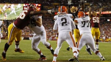 Aug 18, 2014; Landover, MD, USA; Cleveland Browns quarterback Johnny Manziel (2) scrambles with the ball in the end zone as Washington Redskins defensive tackle Barry Cofield (96) chases in the second quarter at FedEx Field. Mandatory Credit: Geoff Burke-USA TODAY Sports