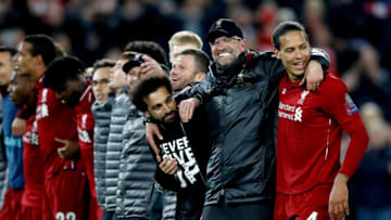 Liverpool's Mohamed Salah (left), manager Jurgen Klopp (centre) and Virgil van Dijk (right) celebrate after the final whistle Liverpool v Barcelona - UEFA Champions League - Semi Final - Second Leg - Anfield 07-05-2019 . (Photo by Martin Rickett/EMPICS/PA Images via Getty Images)