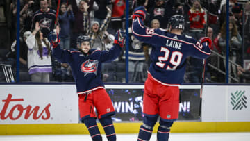 Dec 11, 2022; Columbus, Ohio, USA; Columbus Blue Jackets left wing Johnny Gaudreau (13) celebrates his game winning goal against the Los Angeles Kings with Columbus Blue Jackets left wing Patrik Laine (29) in overtime at Nationwide Arena. Mandatory Credit: Gaelen Morse-USA TODAY Sports