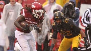 Nov 27, 2015; Fayetteville, AR, USA; Arkansas Razorbacks running back Alex Collins (3) rushes for a touchdown as Missouri Tigers defensive back Anthony Sherrils (22) looks on during the second quarter at Donald W. Reynolds Razorback Stadium. Mandatory Credit: Nelson Chenault-USA TODAY Sports