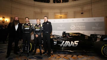 LONDON, ENGLAND - FEBRUARY 07: (L-R) Rich Energy CEO William Storey, drivers Romain Grosjean and Kevin Magnussen and Rich Energy Haas F1 Team Principal Guenther Steiner pose alongside the car during the Rich Energy Haas F1 Team livery unveiling at The Royal Automobile Club on February 07, 2019 in London, England. (Photo by Bryn Lennon/Getty Images)