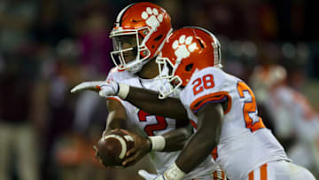 BLACKSBURG, VA - SEPTEMBER 30: Clemson (2) Kelly Bryant (QB) hands the ball to (28) Tavien Feaster (RB) in the backfield during a college football game between the Virginia Tech Hokies and the Clemson Tigers on September 30, 2017 at Lane Stadium on Worsham Field in Blacksburg, VA. (Photo by Lee Coleman/Icon Sportswire via Getty Images)