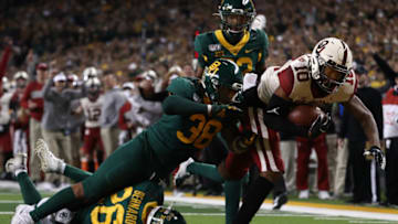 WACO, TEXAS - NOVEMBER 16: Theo Wease #10 of the Oklahoma Sooners runs for a touchdown against Jordan Williams #38 of the Baylor Bears in the second half at McLane Stadium on November 16, 2019 in Waco, Texas. (Photo by Ronald Martinez/Getty Images)