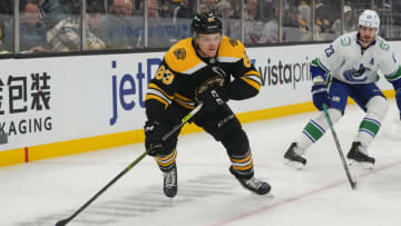 Nov 28, 2021; Boston, Massachusetts, USA; Boston Bruins right wing Karson Kuhlman (83) skates with the puck against the Vancouver Canucks during the first period at TD Garden. Mandatory Credit: Gregory Fisher-USA TODAY Sports