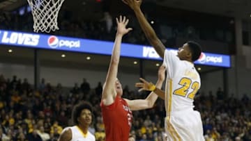 Jan 7, 2015; Richmond, VA, USA; Virginia Commonwealth Rams guard/forward Terry Larrier (22) shoots the ball over Davidson Wildcats forward Peyton Aldridge (23) in the first half at Stuart Siegel Center. The Rams won 71-65. Mandatory Credit: Geoff Burke-USA TODAY Sports