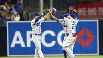 SAN DIEGO, CALIFORNIA - MAY 04: Alex Verdugo #27, Joc Pederson #31 and Chris Taylor #3 of the Los Angeles Dodgers celebrate defeating the San Diego Padres 7-6 in a game at PETCO Park on May 04, 2019 in San Diego, California. (Photo by Sean M. Haffey/Getty Images)