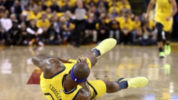 OAKLAND, CALIFORNIA - APRIL 15: DeMarcus Cousins #0 of the Golden State Warriors falls to the crowd after injuring himself against the LA Clippers during Game Two of the first round of the 2019 NBA Western Conference Playoffs at ORACLE Arena on April 15, 2019 in Oakland, California. NOTE TO USER: User expressly acknowledges and agrees that, by downloading and or using this photograph, User is consenting to the terms and conditions of the Getty Images License Agreement. (Photo by Ezra Shaw/Getty Images)