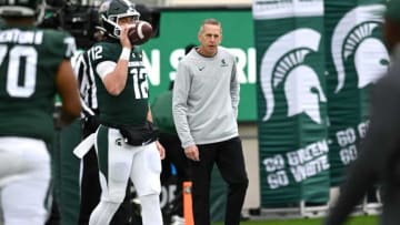 Michigan State's offensive coordinator Jay Johnson works with quarterback before the football game against Rutgers on Saturday, Nov. 12, 2022, in East Lansing.221112 Msu Rutgers Fb 038a