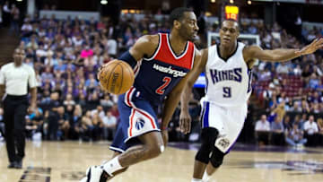 Mar 30, 2016; Sacramento, CA, USA; Washington Wizards guard John Wall (2) drives in against Sacramento Kings guard Rajon Rondo (9) during the first quarter at Sleep Train Arena. Mandatory Credit: Kelley L Cox-USA TODAY Sports