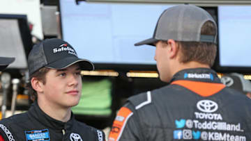 ROSSBURG, OHIO - JULY 31: Harrison Burton, driver of the #18 Safelite AutoGlass Toyota, talks with Todd Gilliland, driver of the #4 JBL/SiriusXM Toyota, during practice for the NASCAR Gander Outdoor Truck Series Eldora Dirt Derby at Eldora Speedway on July 31, 2019 in Rossburg, Ohio. (Photo by Matt Sullivan/Getty Images)