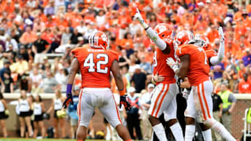 CLEMSON, SC - OCTOBER 07: Defensive end Clelin Ferrell #99, defensive lineman Christian Wilkins #42, and defensive end Austin Bryant #7 of the Clemson Tigers celebrate after a play against the Wake Forest Demon Deacons during the game at Memorial Stadium on October 7, 2017 in Clemson, South Carolina. (Photo by Mike Comer/Getty Images)
