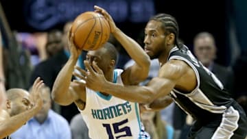 CHARLOTTE, NC - MARCH 21: Teammates Tony Parker