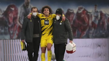 Dortmund's Belgian midfielder Axel Witsel leaves the pitch after suffering an achilles tear (Photo by RONNY HARTMANN/POOL/AFP via Getty Images)