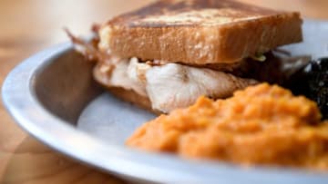 The smoked turkey sandwich at 12 Bones Smokehouse South in Arden is smoked turkey, sugar bacon, brie cheese and pesto mayo on Texas toast.12bonessouth 016