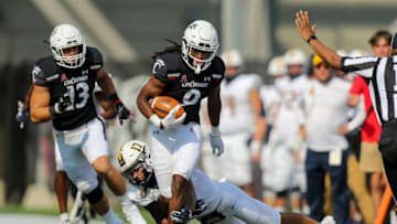 Cincinnati Bearcats cornerback Arquon Bush runs with the ball against Murray State Racers at Nippert Stadium. USA Today.