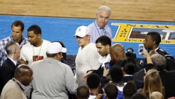 Apr 5, 2014; Arlington, TX, USA; Johnny Manziel and recording artist Drake in attendance during the game between the Kentucky Wildcats and the Wisconsin Badgers during the semifinals of the Final Four in the 2014 NCAA Mens Division I Championship tournament at AT&T Stadium. Mandatory Credit: Matthew Emmons-USA TODAY Sports