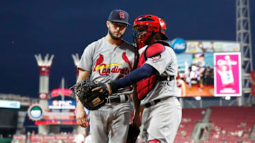 CINCINNATI, OH - JULY 23: Daniel Poncedeleon #62 of the St. Louis Cardinals gets a hug from Yadier Molina #4 after pitching the seventh inning against the Cincinnati Reds during a game at Great American Ball Park on July 23, 2018 in Cincinnati, Ohio. Poncedeleon came out of the game after pitching a no-hitter through seven innings but the Reds won 2-1. (Photo by Joe Robbins/Getty Images)