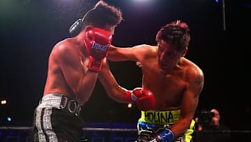 DALLAS, TX - NOVEMBER 28: Jorge Romero and John Molina exchange punches during the Premier Boxing Champions at Bomb Factory on November 28, 2015 in Dallas, Texas. (Photo by Sarah Crabill/Getty Images)