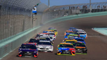 HOMESTEAD, FL - NOVEMBER 18: Denny Hamlin, driver of the #11 FedEx Express Toyota, and Kyle Busch, driver of the #18 M&M's Toyota, take the green flag to start the Monster Energy NASCAR Cup Series Ford EcoBoost 400 at Homestead-Miami Speedway on November 18, 2018 in Homestead, Florida. (Photo by Chris Trotman/Getty Images)