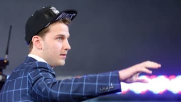 Jun 26, 2014; Brooklyn, NY, USA; Nik Stauskas (Michigan) waves to the crowd as he walks to the stage after being selected as the number eight overall pick to the Sacramento Kings in the 2014 NBA Draft at the Barclays Center. Mandatory Credit: Brad Penner-USA TODAY Sports