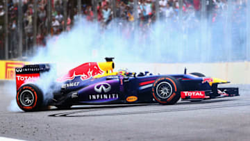 SAO PAULO, BRAZIL - NOVEMBER 24: Sebastian Vettel of Germany and Infiniti Red Bull Racing performs donuts in his car after winning the Brazilian Formula One Grand Prix at Autodromo Jose Carlos Pace on November 24, 2013 in Sao Paulo, Brazil. (Photo by Clive Mason/Getty Images)