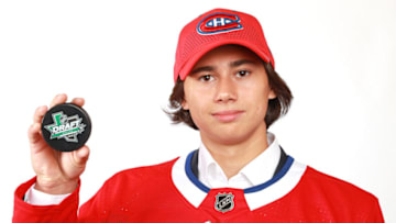 DALLAS, TX - JUNE 23: Alexander Romanov poses after being selected 38th overall by the Montreal Canadiens during the 2018 NHL Draft at American Airlines Center on June 23, 2018 in Dallas, Texas. (Photo by Tom Pennington/Getty Images)