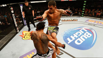 TULSA, OK - AUGUST 23: (R-L) Rafael dos Anjos lands a flying knee to the chin of Benson Henderson in their lightweight fight during the UFC Fight Night event at the BOK Center on August 23, 2014 in Tulsa, Oklahoma. (Photo by Josh Hedges/Zuffa LLC/Zuffa LLC via Getty Images)
