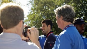 Sep 14, 2015; New York, NY, USA; Novak Djokovic of Serbia walks through Central Park for a portrait session the day after winning the 2015 U.S. Open tennis tournament. Mandatory Credit: Susan Mullane-USA TODAY Sports