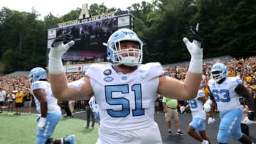 BOONE, NC - SEPTEMBER 3: Ray Vohasek #51 of North Carolina hypes the crowd while taking the field before a game between North Carolina and Appalachian State at Kidd Brewer Stadium on September 3, 2022 in Boone, North Carolina. (Photo by Andy Mead/ISI Photos/Getty Images)