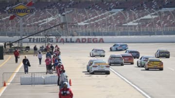 Oct 21, 2016; Talladega, AL, USA; Cars leave pit row and enter the track during the practice for the Alabama 500 at Talladega Superspeedway. Mandatory Credit: Marvin Gentry-USA TODAY Sports