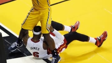 May 30, 2014; Miami, FL, USA; Indiana Pacers guard Lance Stephenson (1) steps over Miami Heat forward LeBron James (6) during the first half in game six of the Eastern Conference Finals of the 2014 NBA Playoffs at American Airlines Arena. Mandatory Credit: Robert Mayer-USA TODAY Sports