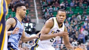 Jan 2, 2016; Salt Lake City, UT, USA; Utah Jazz guard Rodney Hood (5) dribbles the ball as Memphis Grizzlies guard Courtney Lee (5) defends during overtime at Vivint Smart Home Arena. The Jazz won 92-87 in overtime. Mandatory Credit: Russ Isabella-USA TODAY Sports