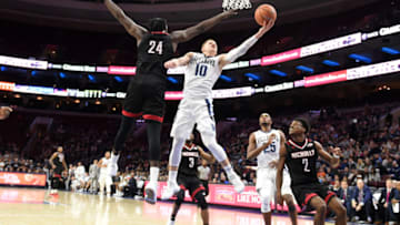 PHILADELPHIA, PA - NOVEMBER 14: Donte DiVincenzo #10 of the Villanova Wildcats takes a shot over Daniel Regis #24 of the Nicholls State Colonelsduring a college basketball game at the Wells Fargo Arena on November 14, 2017 in Philadelphia, Pennsylvania. The Wildcats won 113-77. (Photo by Mitchell Layton/Getty Images)