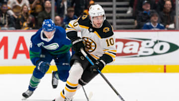 VANCOUVER, BC - FEBRUARY 22: Anders Bjork #10 of the Boston Bruins skates with the puck during NHL action against the Vancouver Canucks at Rogers Arena on February 22, 2020 in Vancouver, Canada. (Photo by Rich Lam/Getty Images)